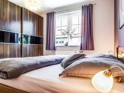 Ein Bett oder Betten in einem Zimmer der Unterkunft Mühlenstraße 8 Whg 2
