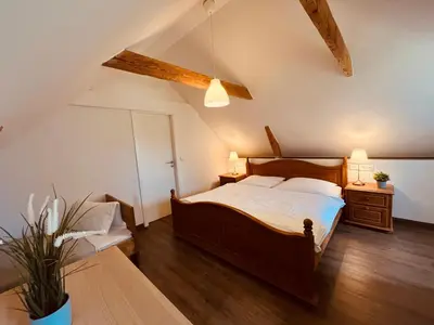 Ein Bett oder Betten in einem Zimmer der Unterkunft Ferienwohnung de lütte Leive in Born