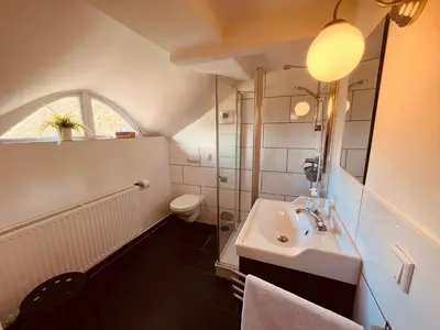 Ein Badezimmer in der Unterkunft Ferienwohnung de lütte Leive in Born