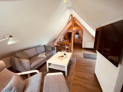 Ein Sitzbereich in der Unterkunft Ferienwohnung de lütte Leive in Born