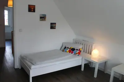 Ein Bett oder Betten in einem Zimmer der Unterkunft Ferienhaus De niege Leive