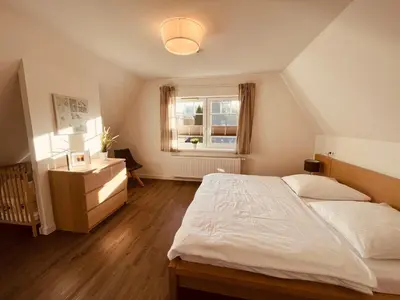 Ein Bett oder Betten in einem Zimmer der Unterkunft Ferienwohnung de olle Leive in Born