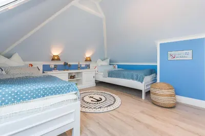 Ein Bett oder Betten in einem Zimmer der Unterkunft Lütten Kate 03