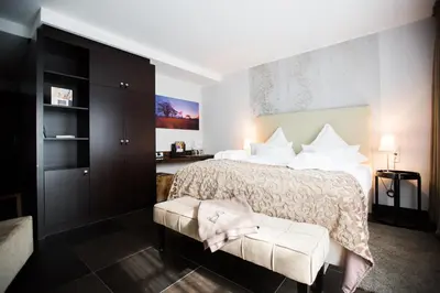 Ein Bett oder Betten in einem Zimmer der Unterkunft Hotel Künstlerquartier Seezeichen