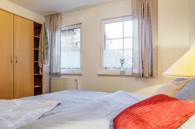 Ein Bett oder Betten in einem Zimmer der Unterkunft Stürmann