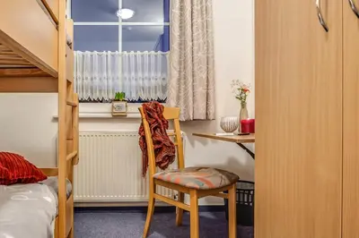 Ein Bett oder Betten in einem Zimmer der Unterkunft Stürmann