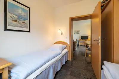 Ein Bett oder Betten in einem Zimmer der Unterkunft Villa Dünenblick 02
