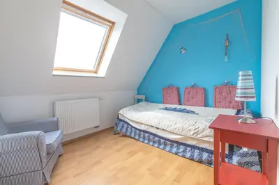 Ein Bett oder Betten in einem Zimmer der Unterkunft Ferienhaus Kranich