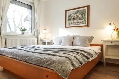Ein Bett oder Betten in einem Zimmer der Unterkunft Birkenstraße 11a Whg 11