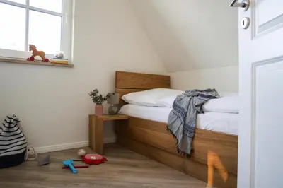 Ein Bett oder Betten in einem Zimmer der Unterkunft Luxushaus Bodstedt mit Lagunenschwimmen