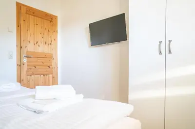 Ein Bett oder Betten in einem Zimmer der Unterkunft Holzkate