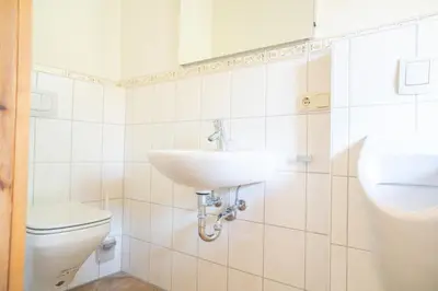 Ein Badezimmer in der Unterkunft Holzkate