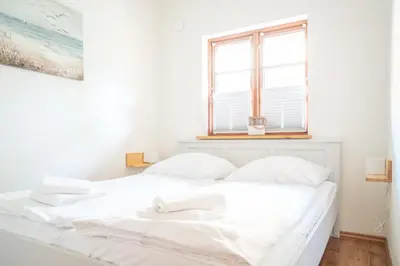 Ein Bett oder Betten in einem Zimmer der Unterkunft Holzkate