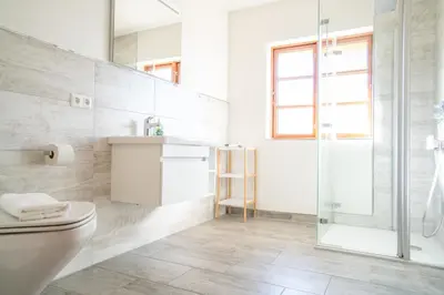 Ein Badezimmer in der Unterkunft Holzkate
