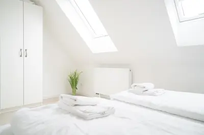 Ein Bett oder Betten in einem Zimmer der Unterkunft Mühlenhaus - Kornstube