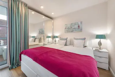 Ein Bett oder Betten in einem Zimmer der Unterkunft Kleine Lagune