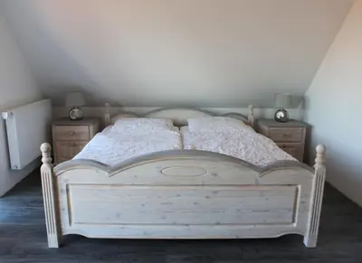 Ein Bett oder Betten in einem Zimmer der Unterkunft Ferienhaus Harmonia