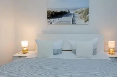 Ein Bett oder Betten in einem Zimmer der Unterkunft Sterntaucher 01