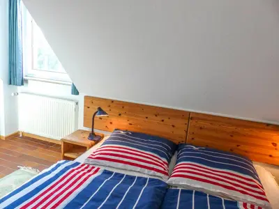 Ein Bett oder Betten in einem Zimmer der Unterkunft Residenz Kormoran, Windflüchter