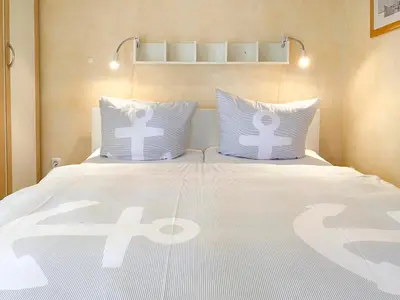 Ein Bett oder Betten in einem Zimmer der Unterkunft Villa Seeluft, No 8