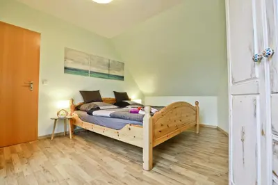 Ein Bett oder Betten in einem Zimmer der Unterkunft Ferienzeit