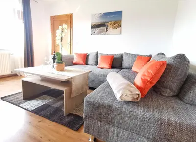 Ein Sitzbereich in der Unterkunft Ferienwohnung An den Tannen