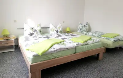 Ein Bett oder Betten in einem Zimmer der Unterkunft Ferienwohnung An den Tannen