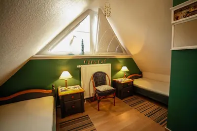 Ein Bett oder Betten in einem Zimmer der Unterkunft Ferienwohnung SÜN