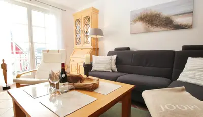 Ein Sitzbereich in der Unterkunft Ferienwohnung SÜN