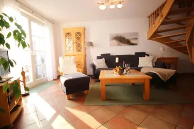 Ein Sitzbereich in der Unterkunft Ferienwohnung SÜN