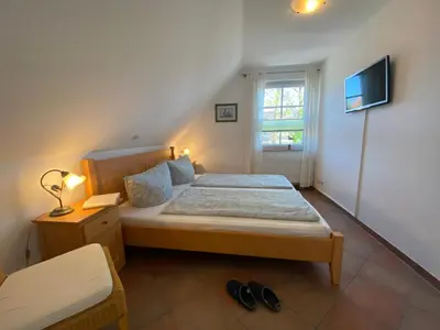 Ein Bett oder Betten in einem Zimmer der Unterkunft Ferienwohnung SÜN