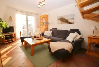 Ein Sitzbereich in der Unterkunft Ferienwohnung SÜN