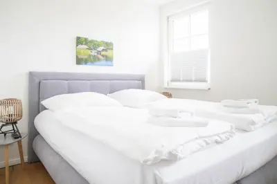Ein Bett oder Betten in einem Zimmer der Unterkunft Jade 3