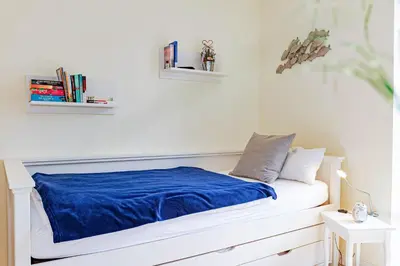 Ein Bett oder Betten in einem Zimmer der Unterkunft Wellenflüstern