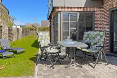Ein Garten an der Unterkunft Wellenflüstern