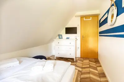 Ein Bett oder Betten in einem Zimmer der Unterkunft Ferienhaus Ankerherz