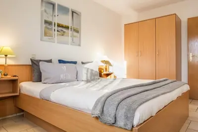Ein Bett oder Betten in einem Zimmer der Unterkunft Utkiek