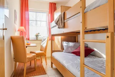 Ein Bett oder Betten in einem Zimmer der Unterkunft Utkiek