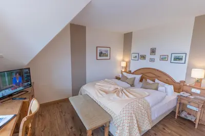 Ein Bett oder Betten in einem Zimmer der Unterkunft Romantik Hotel Namenlos