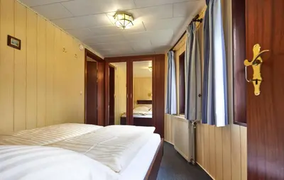 Ein Bett oder Betten in einem Zimmer der Unterkunft Hotelschiff Stinne