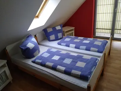 Ein Bett oder Betten in einem Zimmer der Unterkunft Maisonettewohnung auf 2 Etagen mit zwei Balkonen