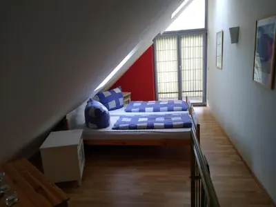 Ein Bett oder Betten in einem Zimmer der Unterkunft Maisonettewohnung auf 2 Etagen mit zwei Balkonen
