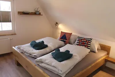 Ein Bett oder Betten in einem Zimmer der Unterkunft Boddenkahn