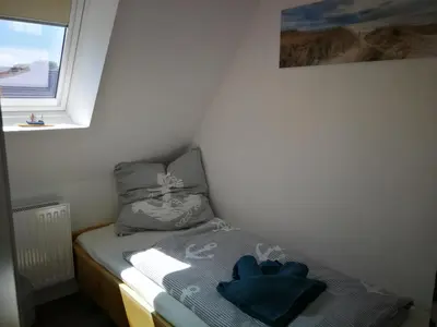 Ein Bett oder Betten in einem Zimmer der Unterkunft Boddenkahn