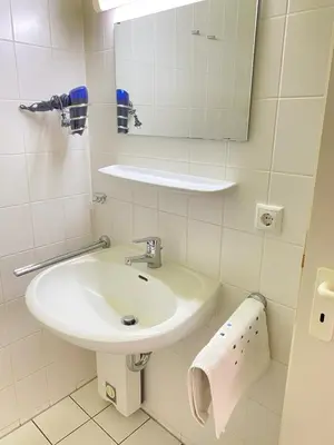 Ein Badezimmer in der Unterkunft Haus Claudia