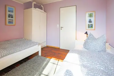 Ein Bett oder Betten in einem Zimmer der Unterkunft bi uns to Hus