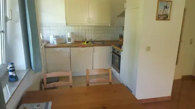 Küche/Küchenzeile in der Unterkunft Ferienwohnung Mühlenstr Prerow, ruhig, zentral, mit Terrasse