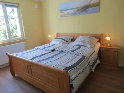 Ein Bett oder Betten in einem Zimmer der Unterkunft Sigi sin Hus 26a