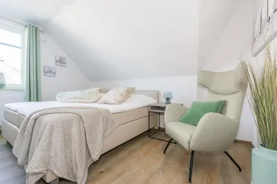 Ein Bett oder Betten in einem Zimmer der Unterkunft Meerglas