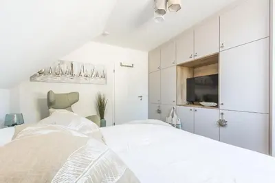 Ein Bett oder Betten in einem Zimmer der Unterkunft Meerglas